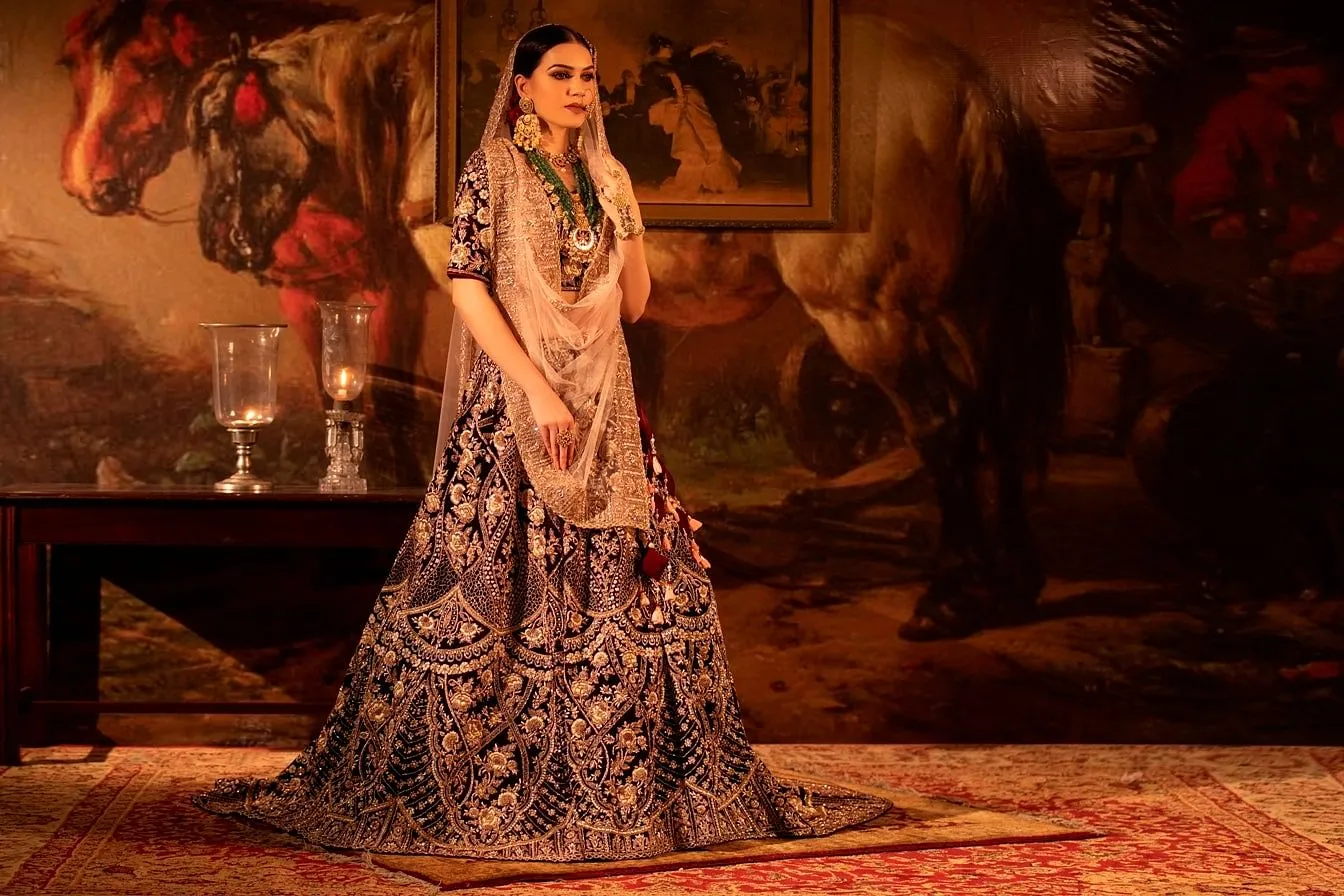 Maroon Velvet Lehenga with peach Dupatta Set.